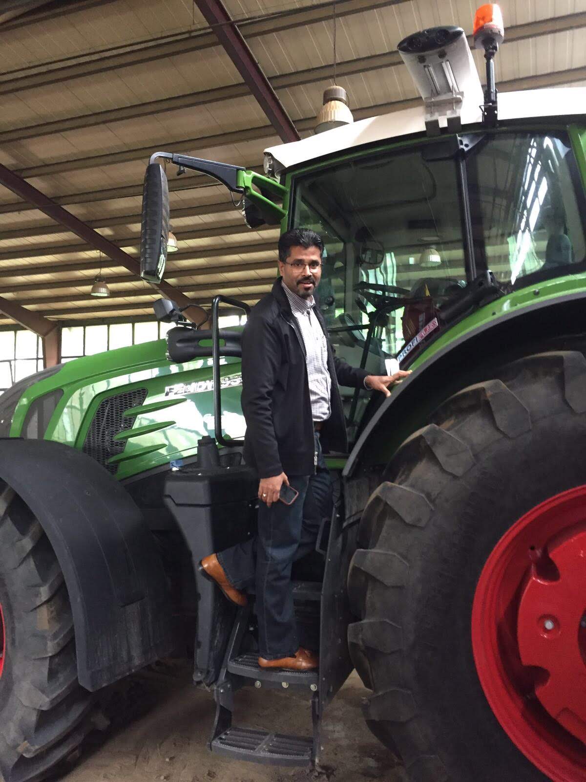Founder boarding a Fendt tractor during the German agri-tech study tour