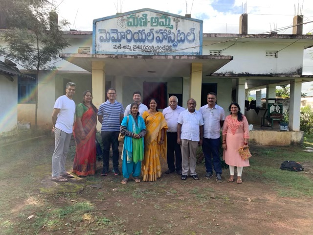 Outside Mani Amma Memorial Hospital with the community team