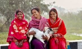 Women SHG members holding livestock — inclusive rural enterprise